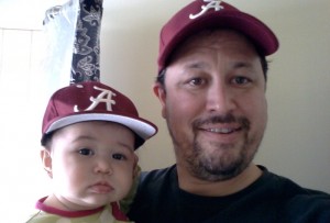 Father and daughter honing Roll Tide game face